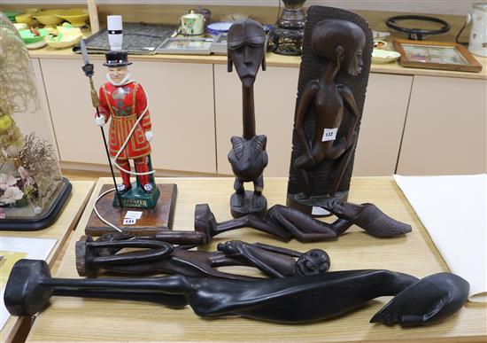 Two Makonde figures and a Papua New Guinea tribal mask and two Makonde figures tallest 95cm